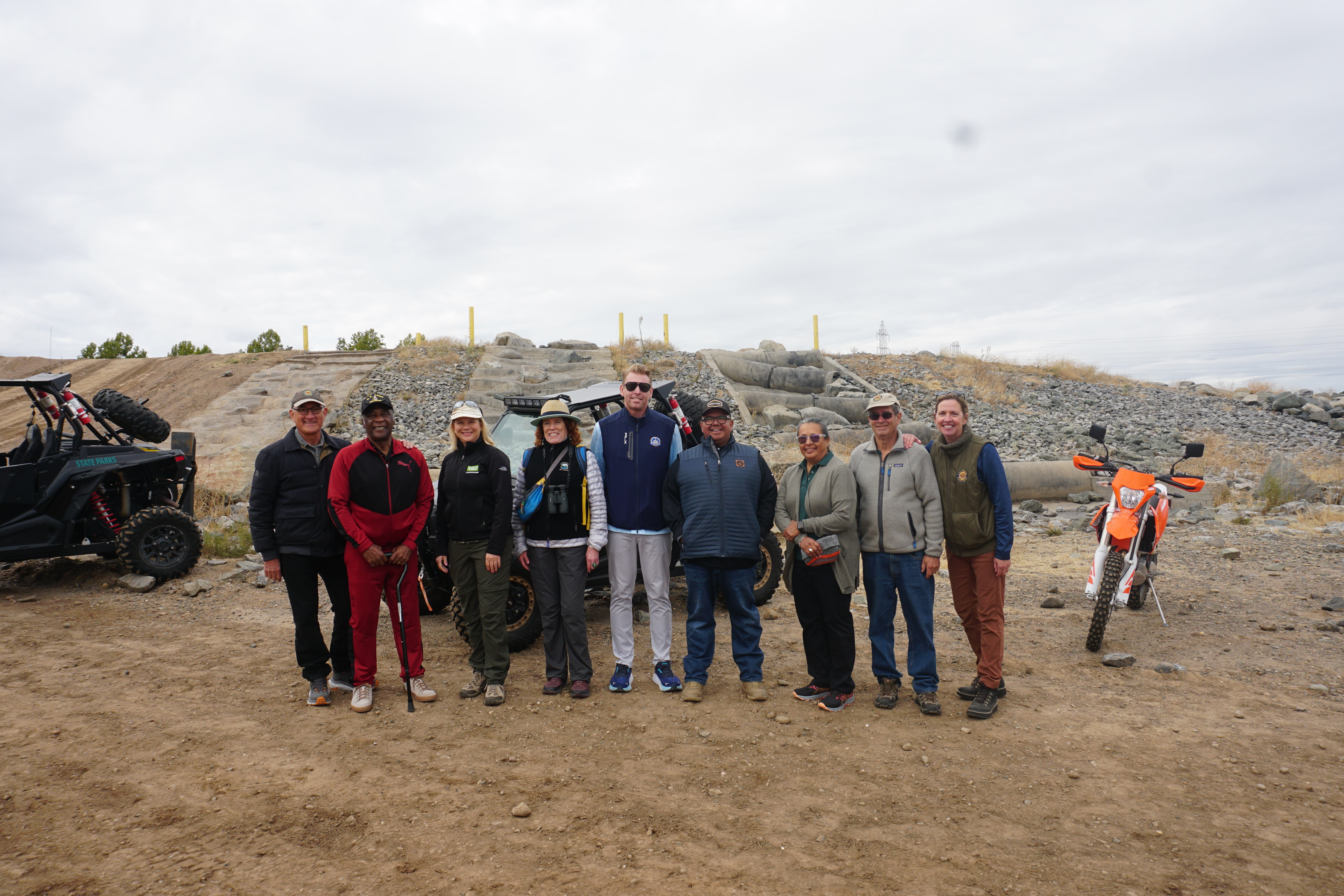 photo of OHV commissioners in front of 4x4 obstacle Prairie City